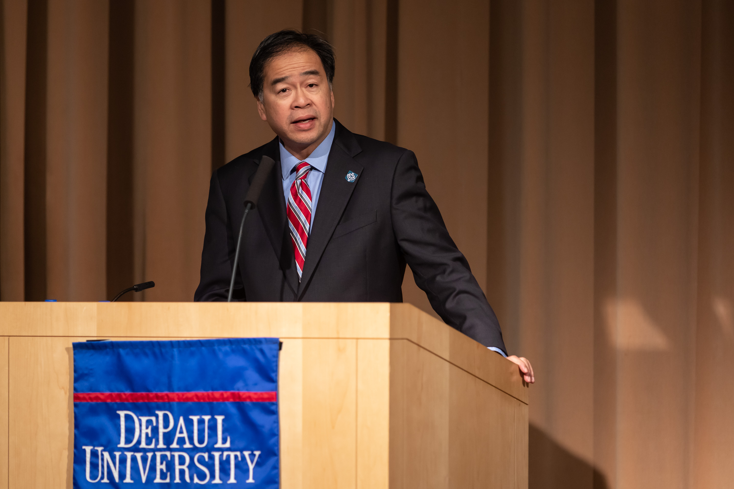 A. Gabriel Esteban, Ph.D., president of DePaul University, introduces Wes Moore during the event on March 14 in the Lincoln Park Student Center. (DePaul University/Jeff Carrion) 